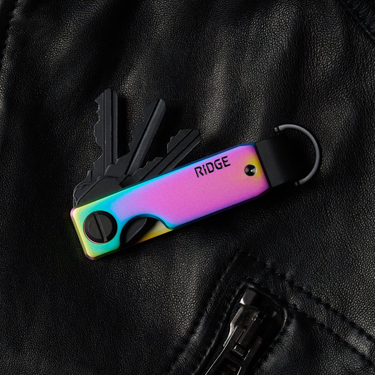 https://cdn.shopify.com/s/files/1/0613/6213/files/Iridescence-Keycase-Lifestyle1.jpg?v=1770821412