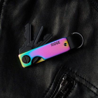 https://cdn.shopify.com/s/files/1/0613/6213/files/Iridescence-Keycase-Lifestyle1.jpg?v=1770821412