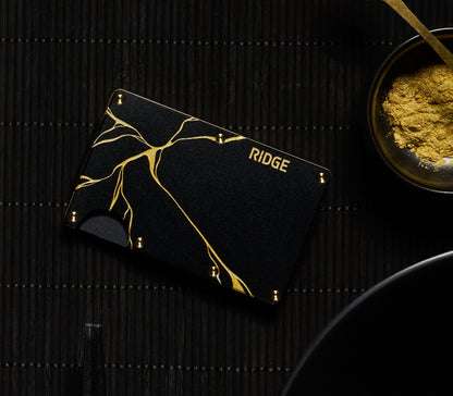 https://cdn.shopify.com/s/files/1/0613/6213/files/Kintsugi-Black-Wallet-Lifestyle1.jpg?v=1743008938