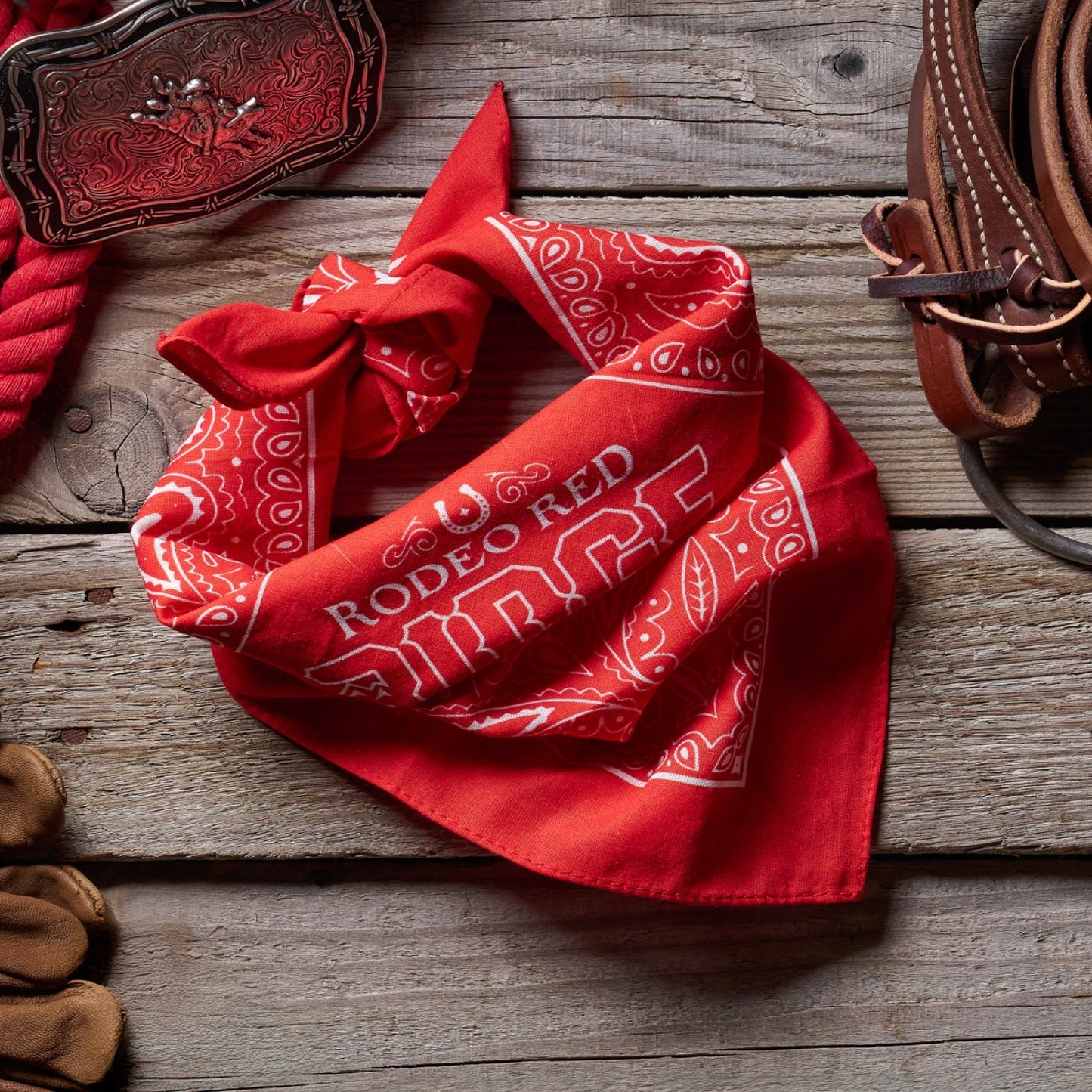 https://cdn.shopify.com/s/files/1/0613/6213/files/Rodeo-Red-Bandana-Lifestyle1.jpg?v=1758792114