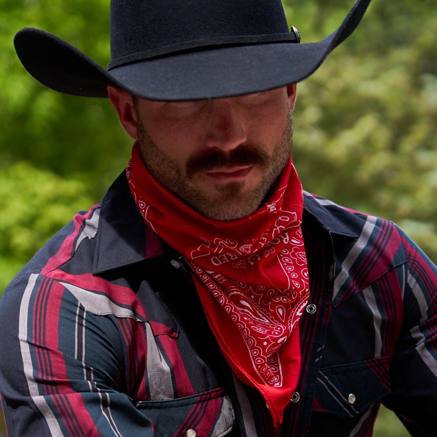 https://cdn.shopify.com/s/files/1/0613/6213/files/Rodeo-Red-Bandana-Lifestyle2.jpg?v=1758792205