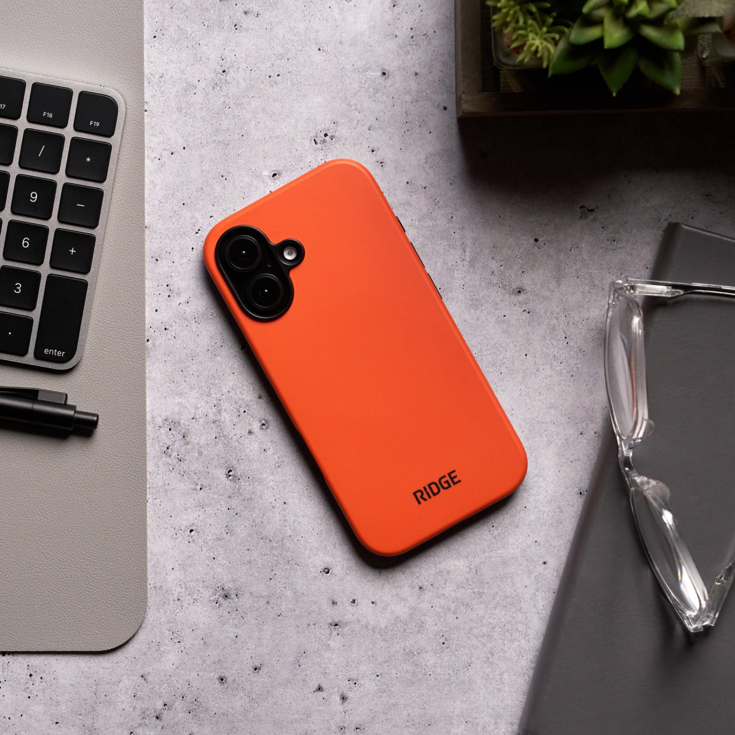 https://cdn.shopify.com/s/files/1/0613/6213/files/iPhone16-Orange-Lifestyle1.jpg?v=1757285858