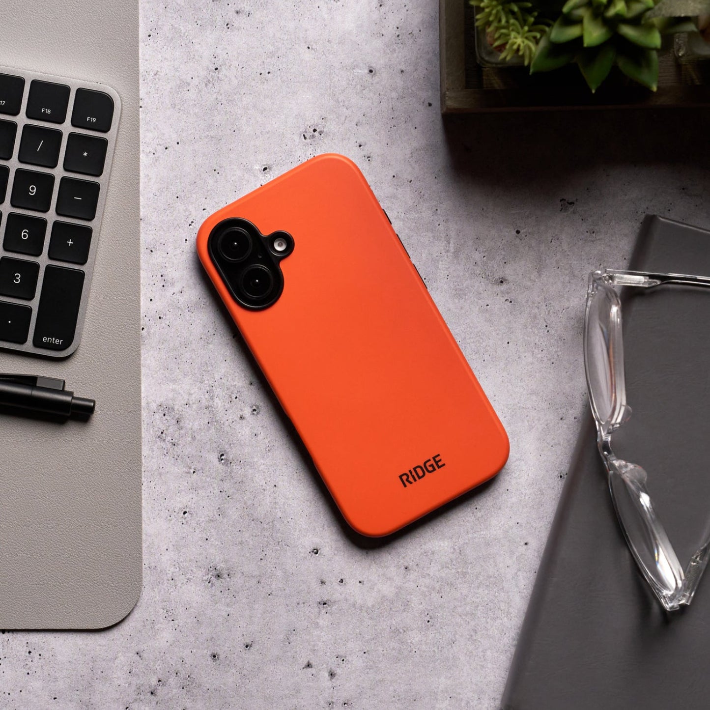 https://cdn.shopify.com/s/files/1/0613/6213/files/iPhone16Plus-Orange-Lifestyle1.jpg?v=1757285850